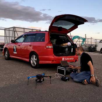 man using drone outfitted with sensors