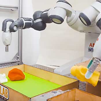 photo of robotic arms using grippers